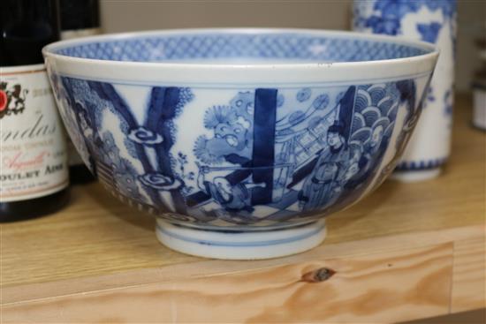 Two Chinese blue and white bowls and a famille rose bowl, 18th/19th century (3) Diameter 23cm